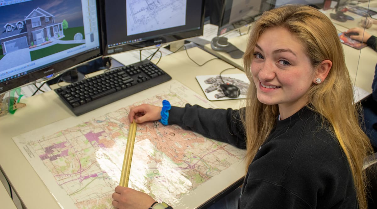 An Engineering and Architectural Design student works on a design in the program lab.