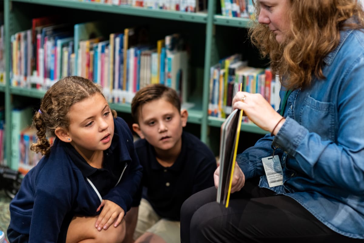 A Summit teacher working one-on-one with a student