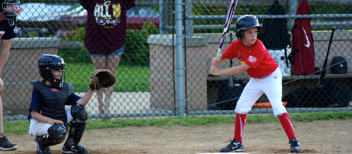 A batter and catcher during a Lakewood youth baseball game.