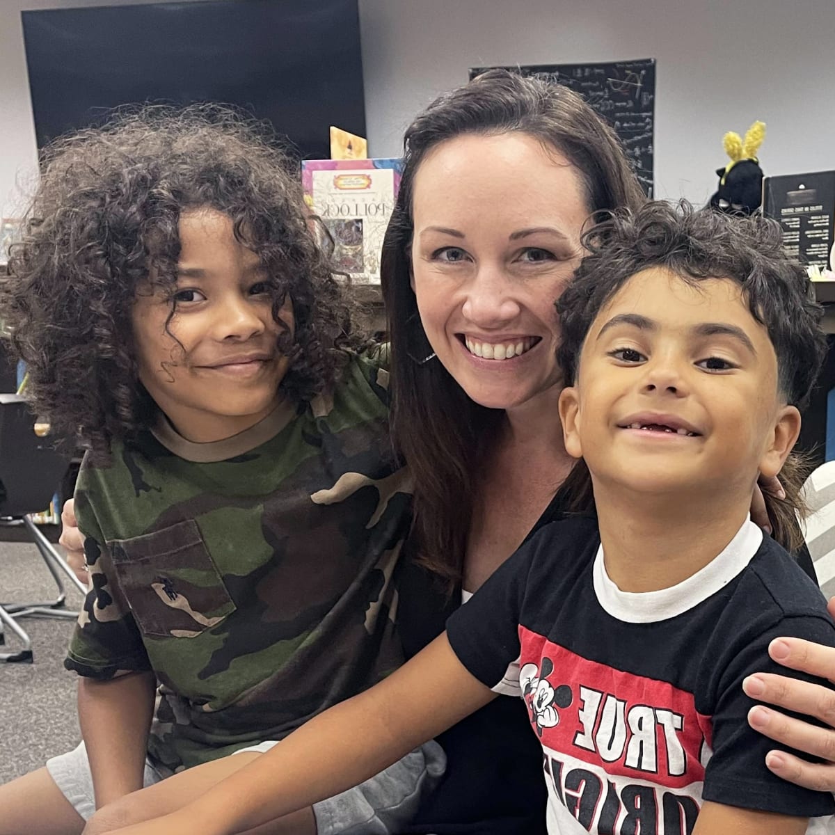 Teacher with two young students