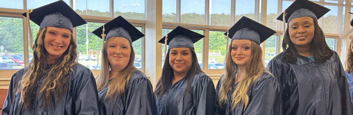 Five 2023 High School Graduates standing in a row