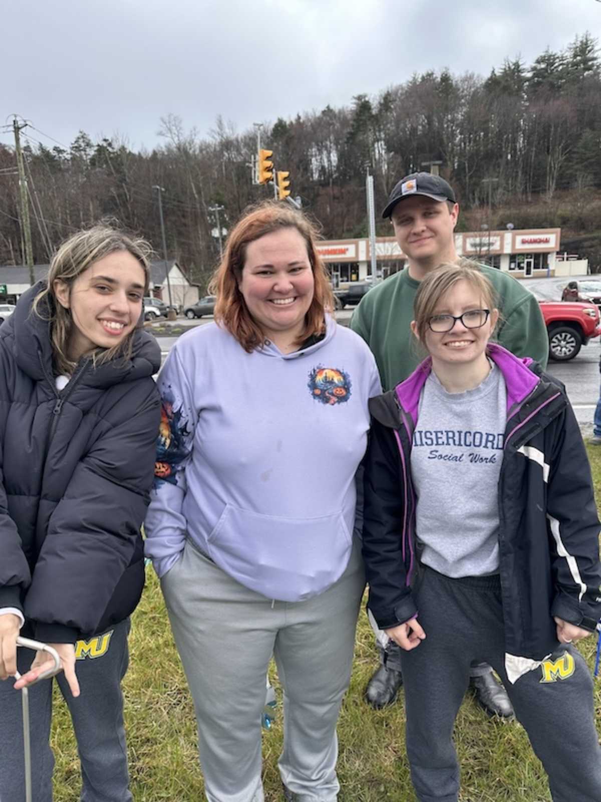 Misericordia University students smiling together outdoors