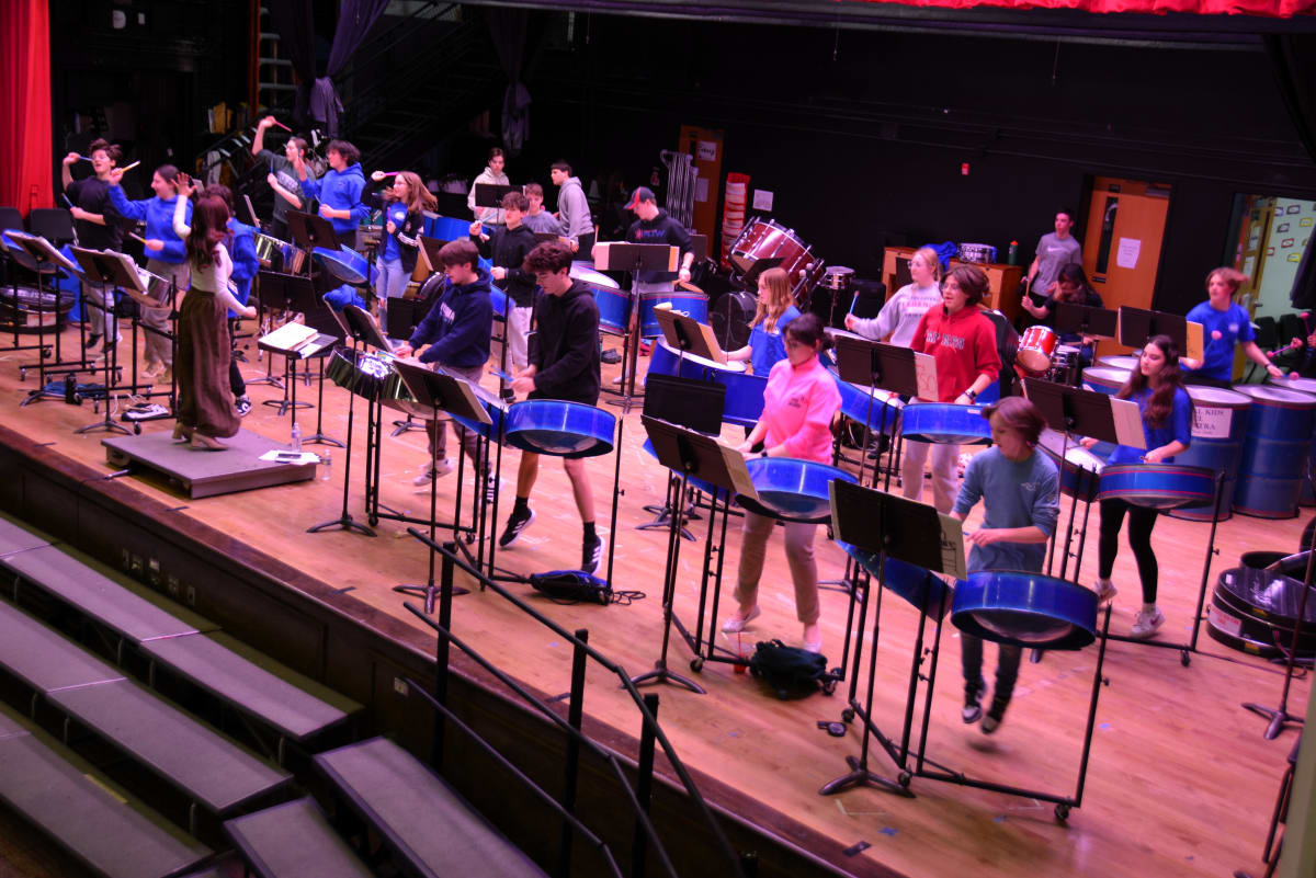 CKSO students jump around as they rehearse a song at LMS