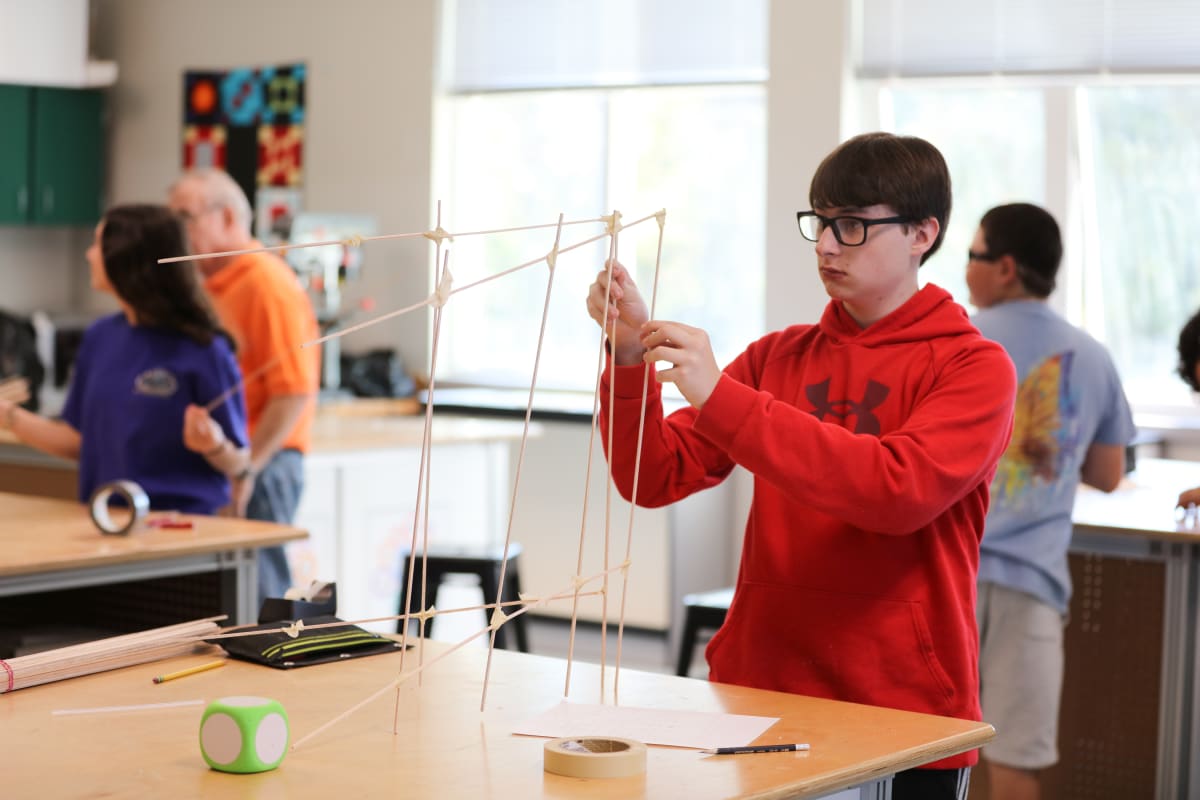 Middle school students builds tower in science class