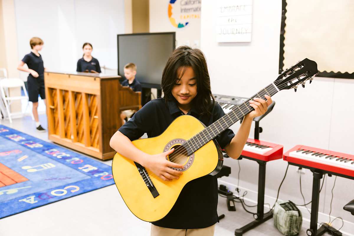 a child playing guitar