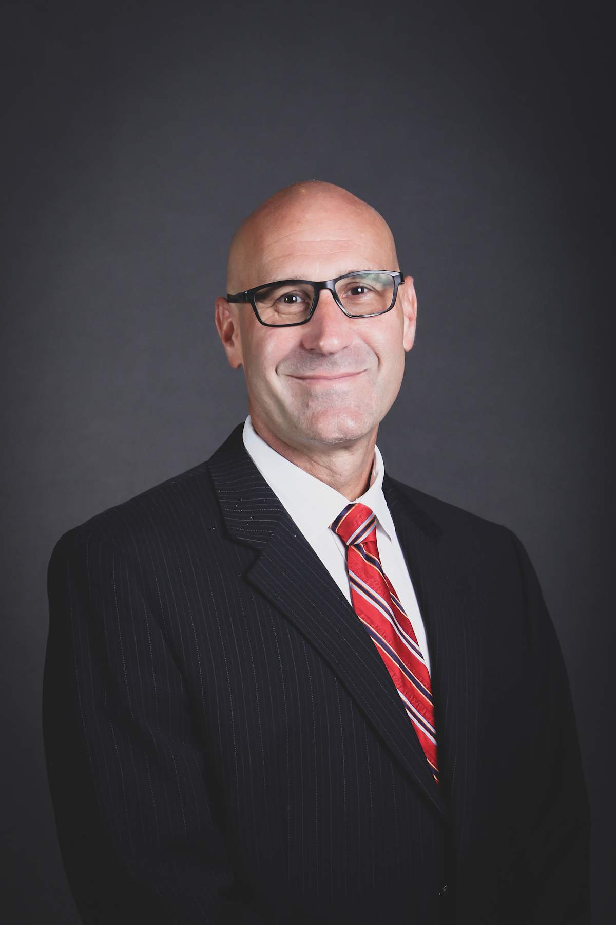 Dr. Michael E. Lofton