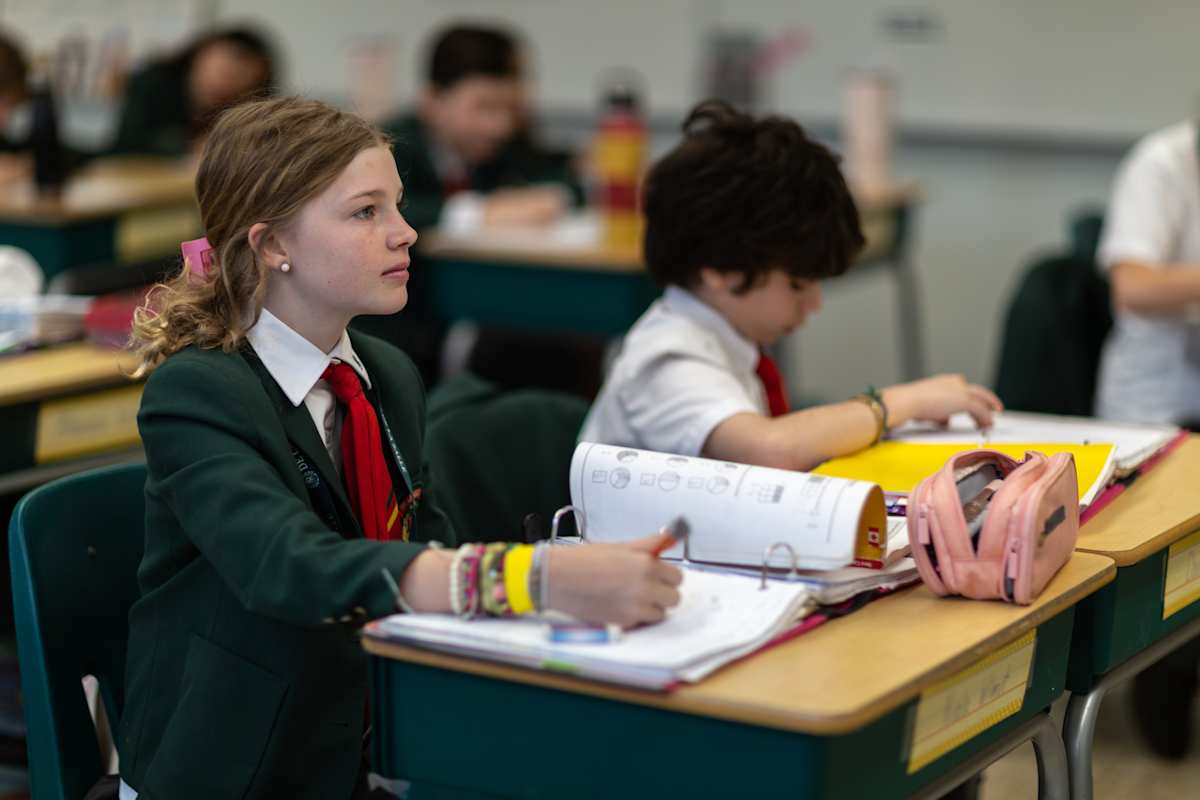 Students reviewing a plan