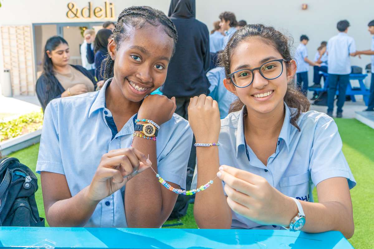 Students SHowcasing their Black History Month Bracelets