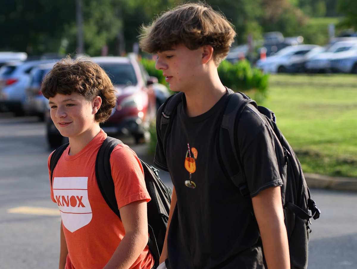 two boys walk into school
