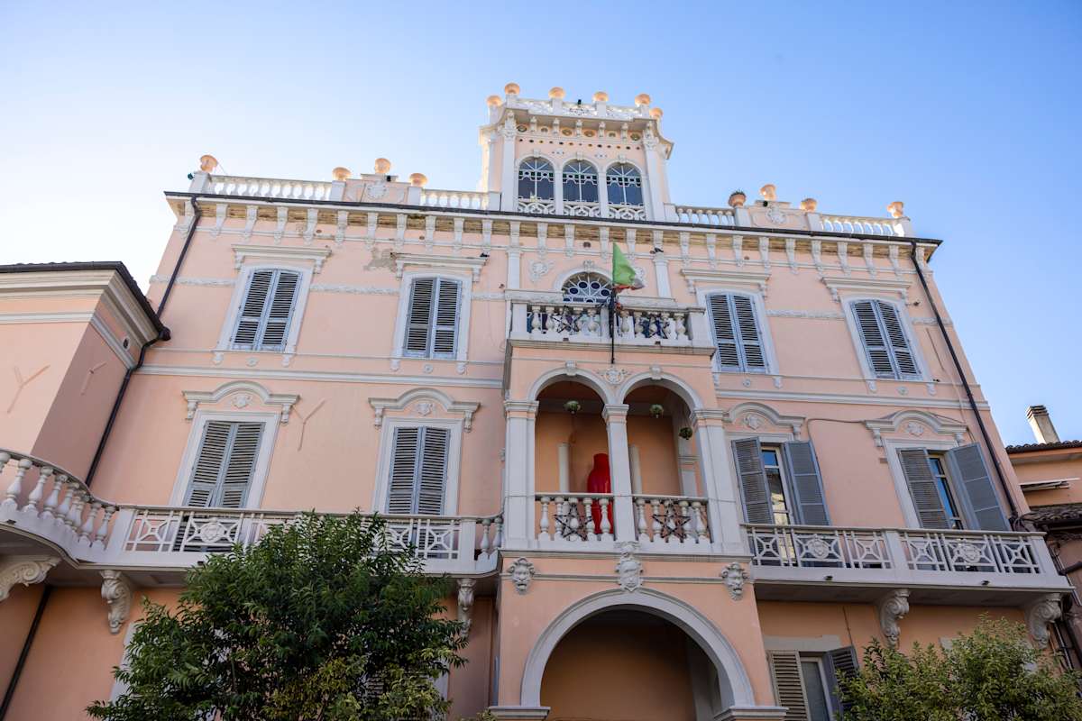 The distinctive pink façade and entrance of Palazzo De Giorgio in Lanciano