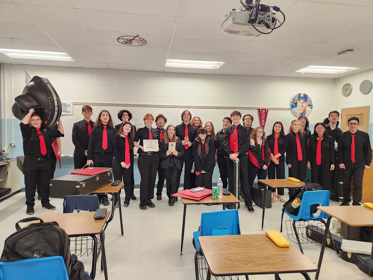 Jazz Band students stand in a row and smile