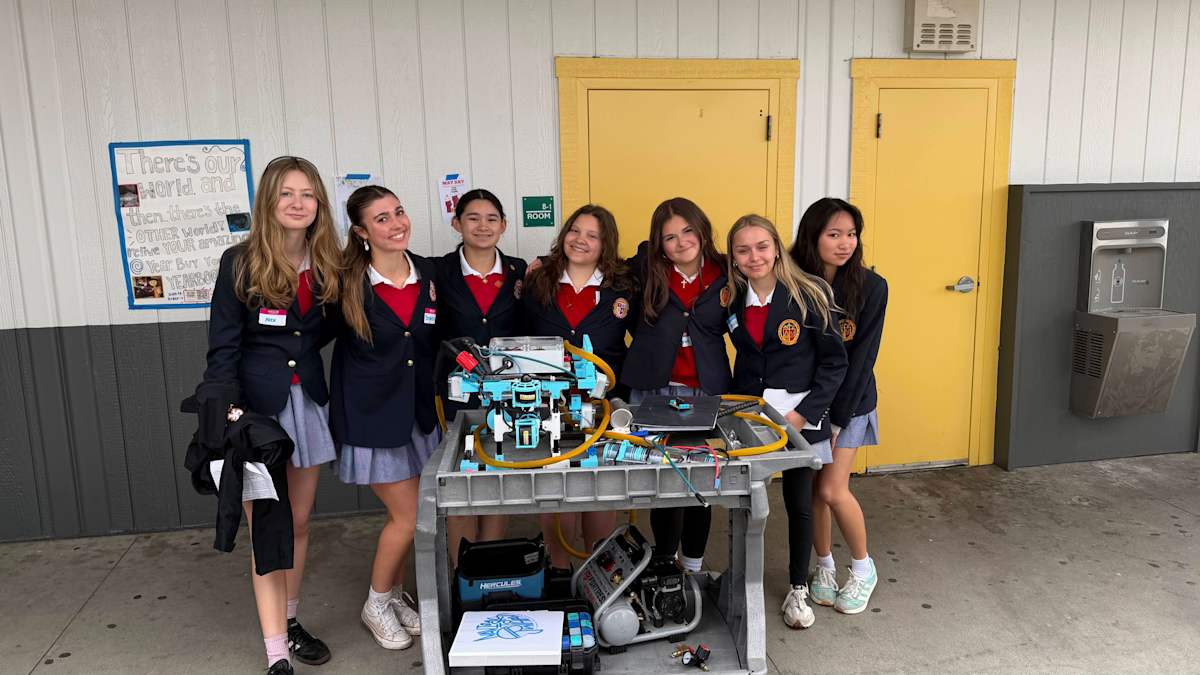 St. Francis MATE Robotics team with their robot
