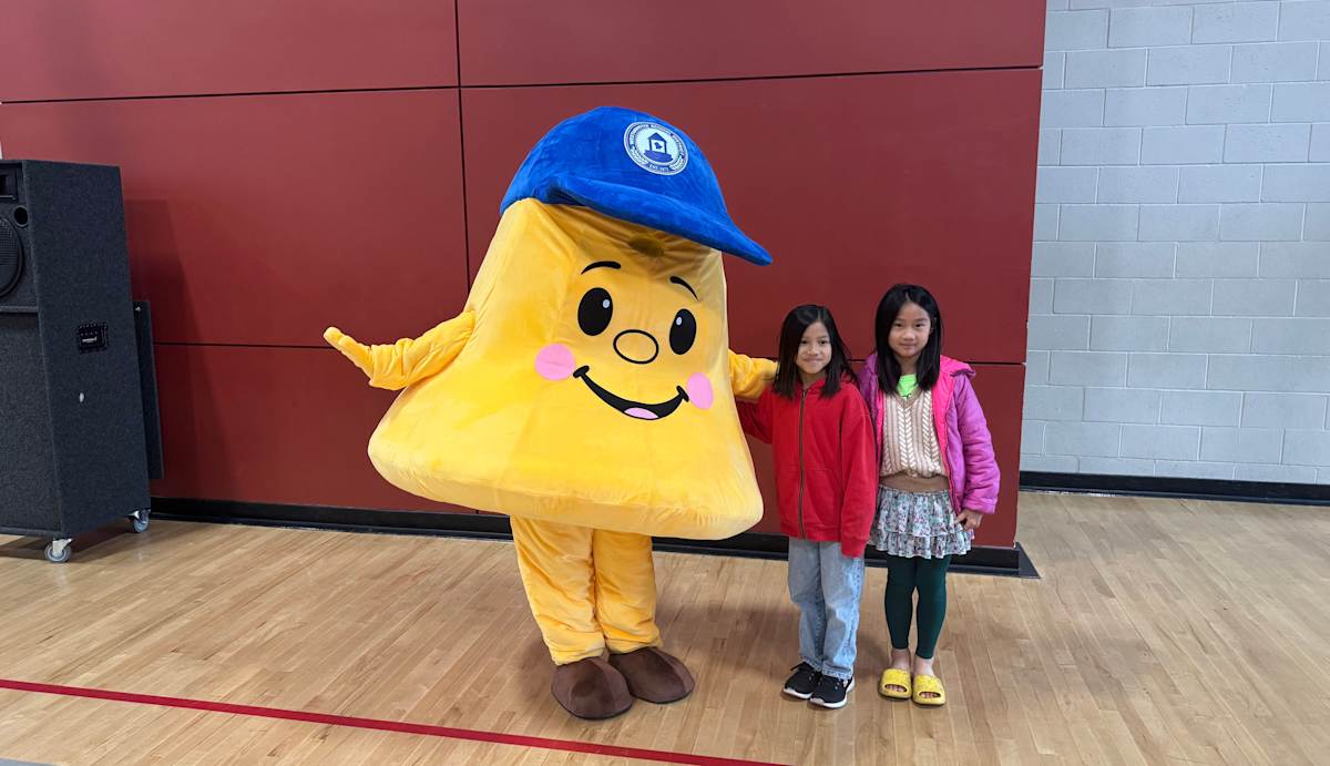 The yellow bell mascot of the district.