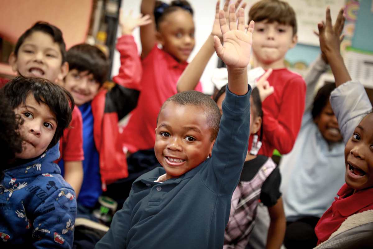 Boy raising his hand