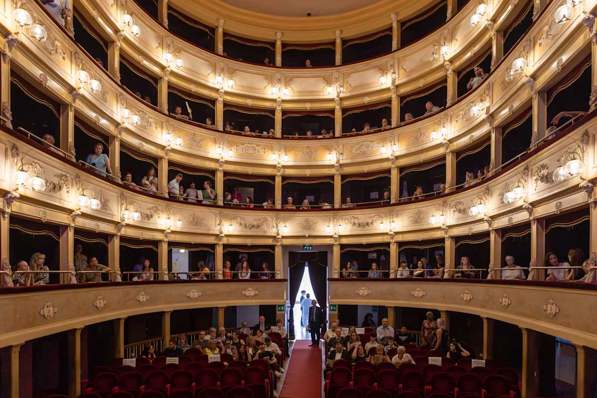 The historic interior and balconies of Teatro Fenaroli