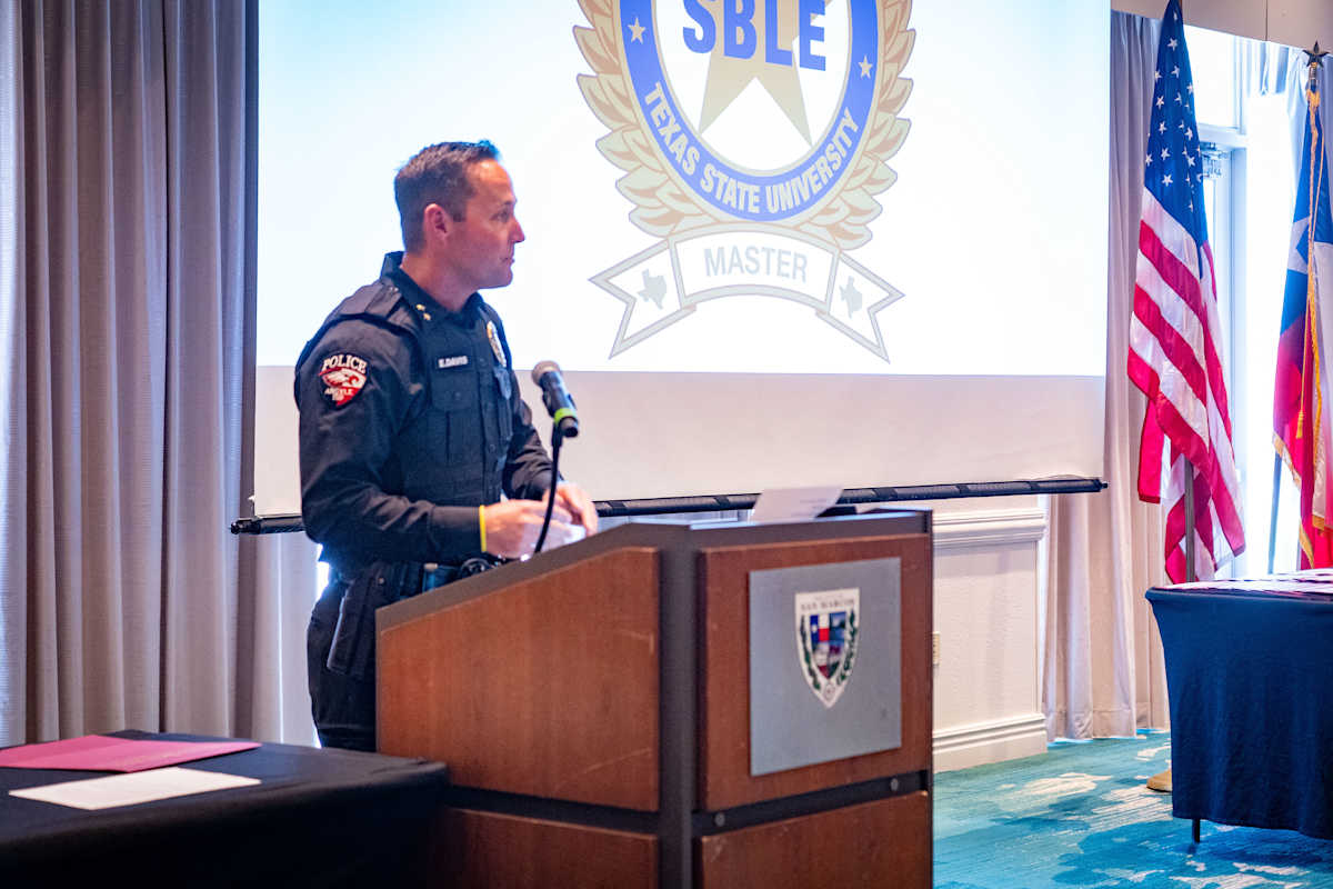 Argyle ISD Police Chief Eli Davis speaks at the TCOLE SBLE Master Training graduation