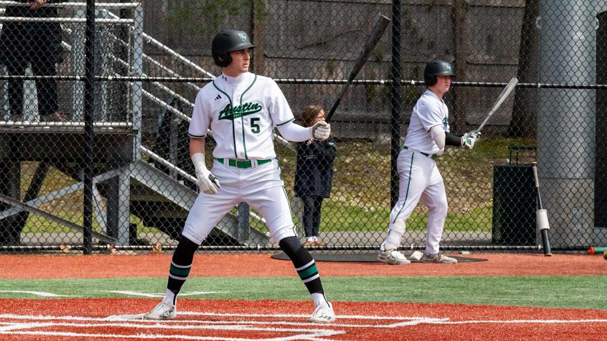 Austin Prep varsity baseball player batting during a game