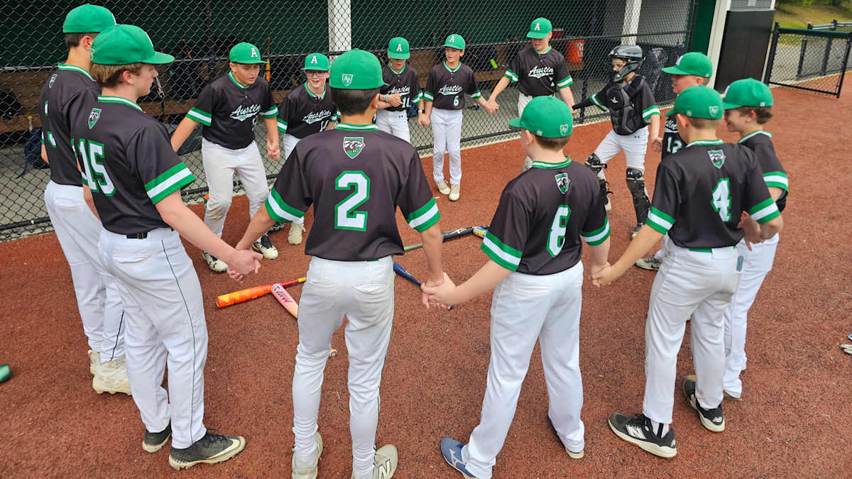 Austin Prep Middle School baseball student-athletes together on the field