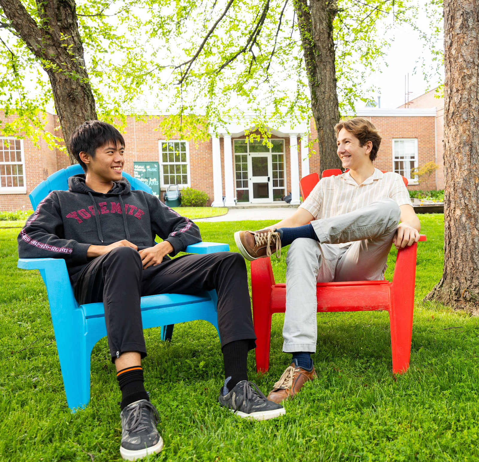 Two NA Boys Seated in The Courtyard
