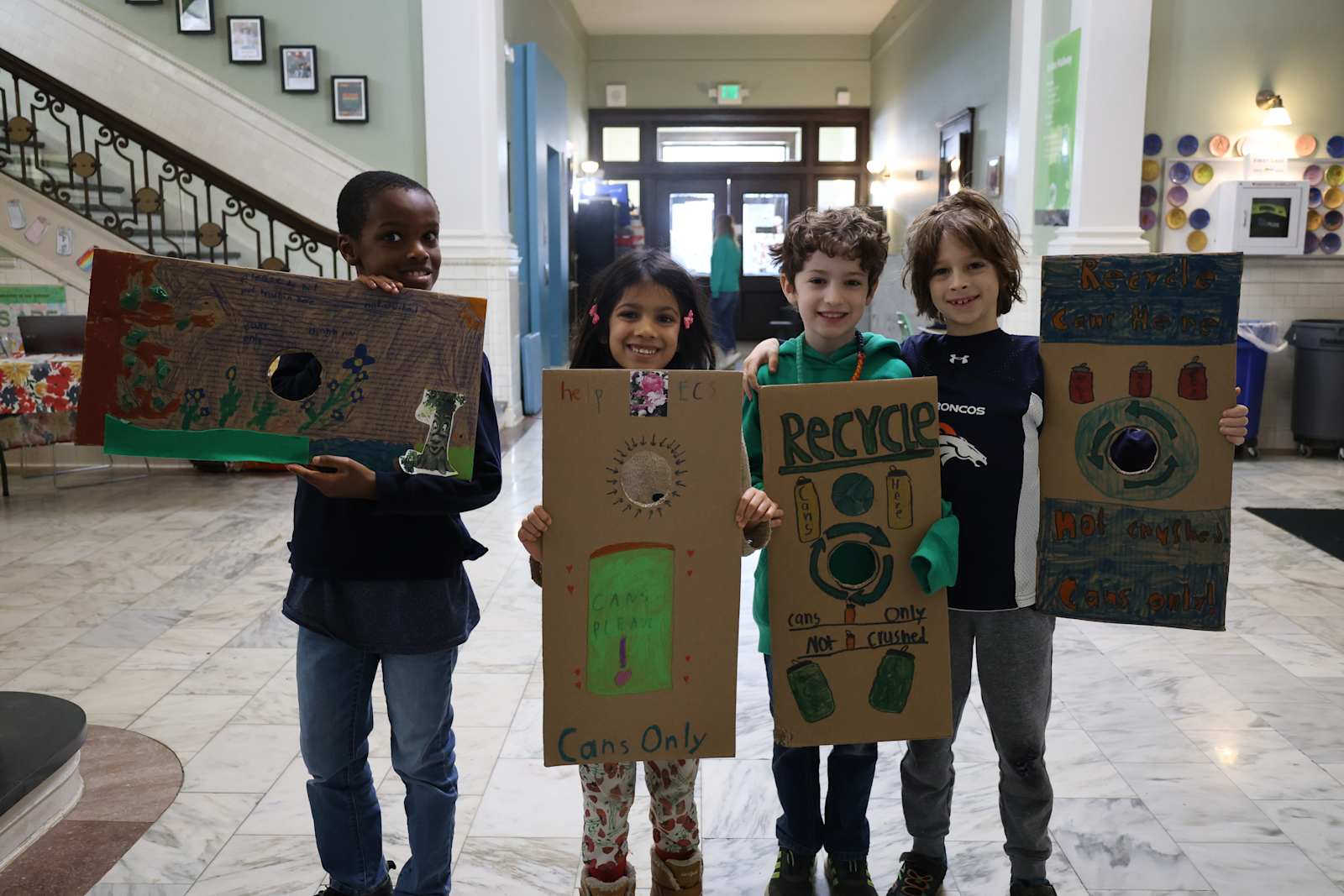 Primary students showing their environmental artwork