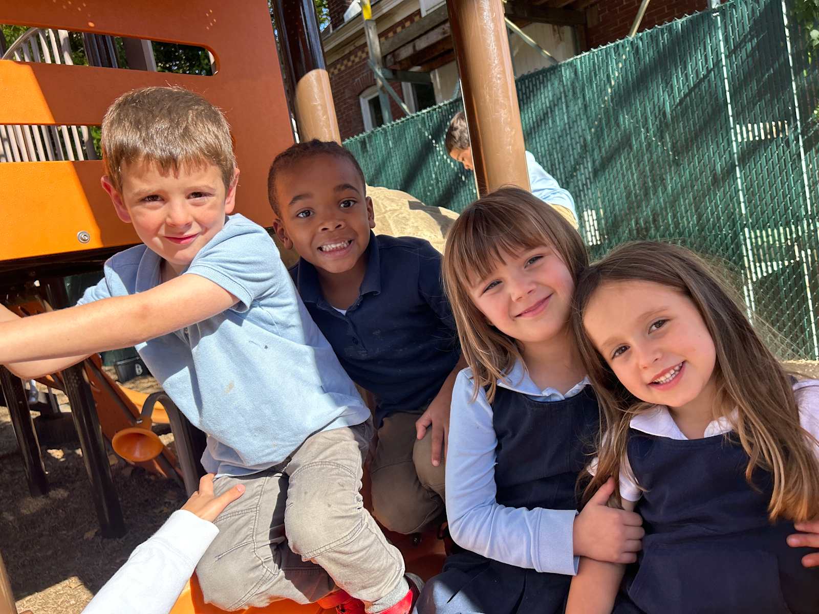 Primary students playing together on the playground