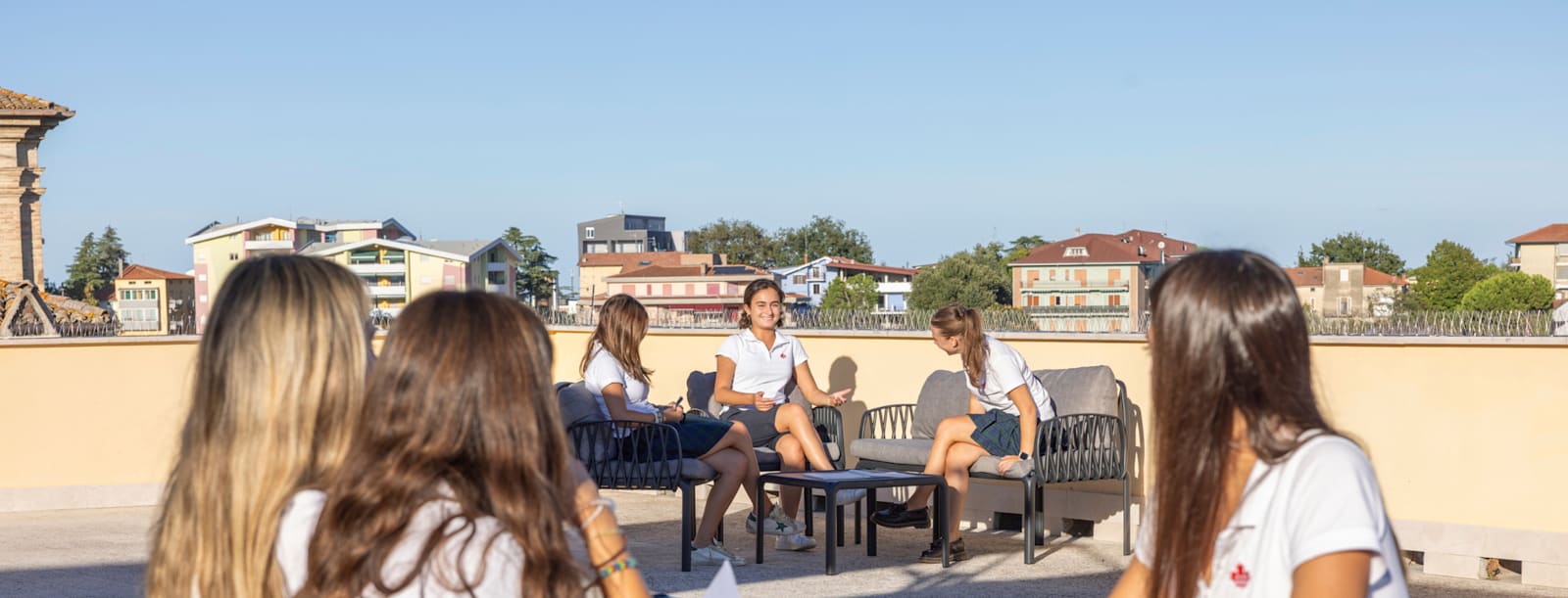 Students spending time together on the Cuore residence rooftop