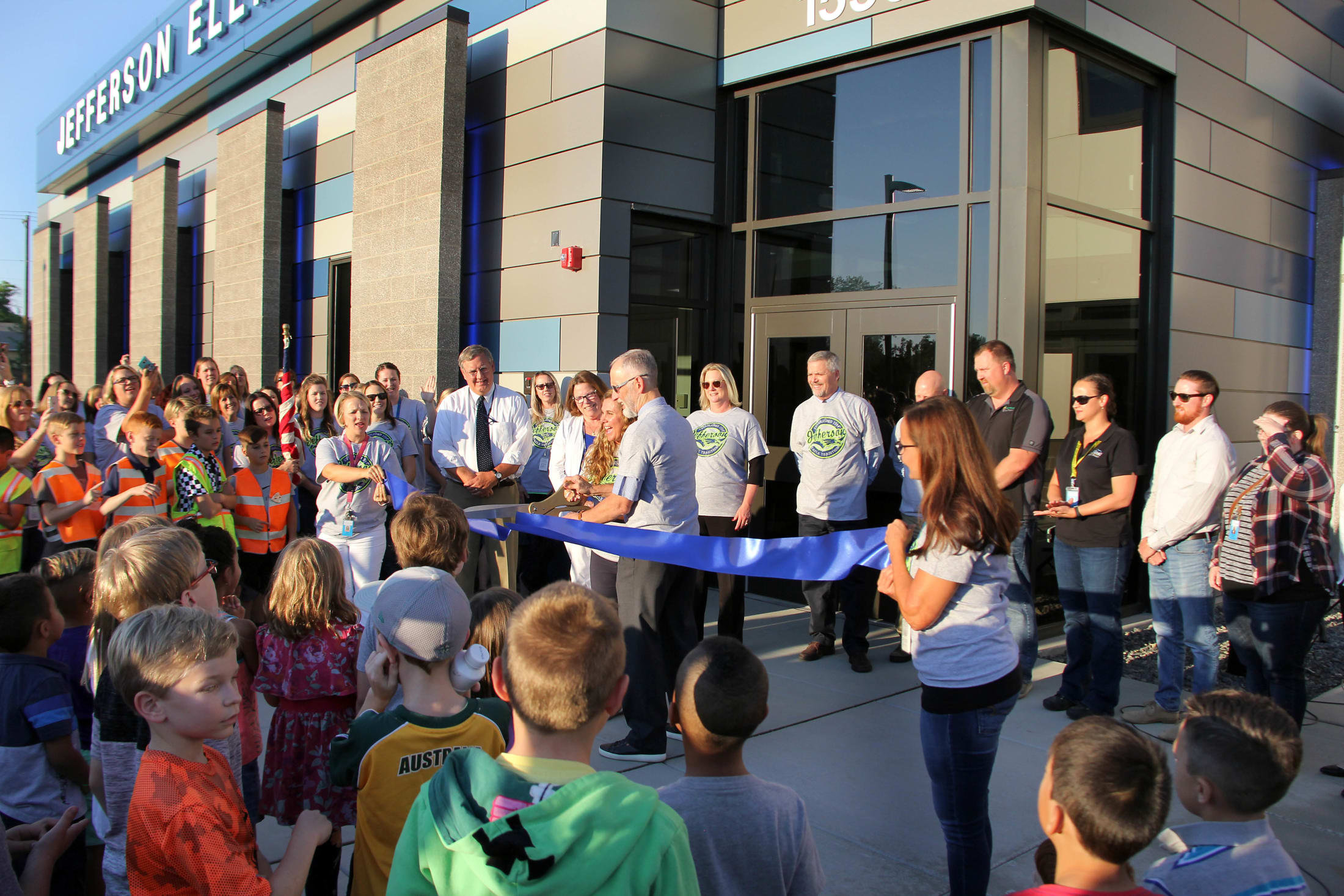 Superintendent Rick Schulte and Principal Bobbi Buttars cut the ribbon at the ribbon cutting and open house for the new Jeffe
