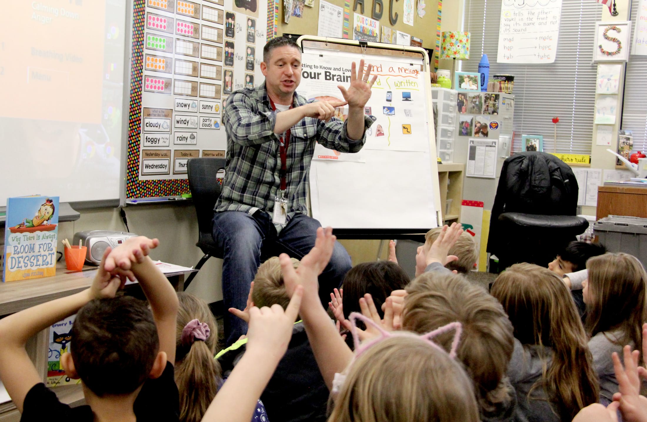 Jason Lee Elementary Counselor Brian Neill works with first-graders during a social-emotional learning lesson.