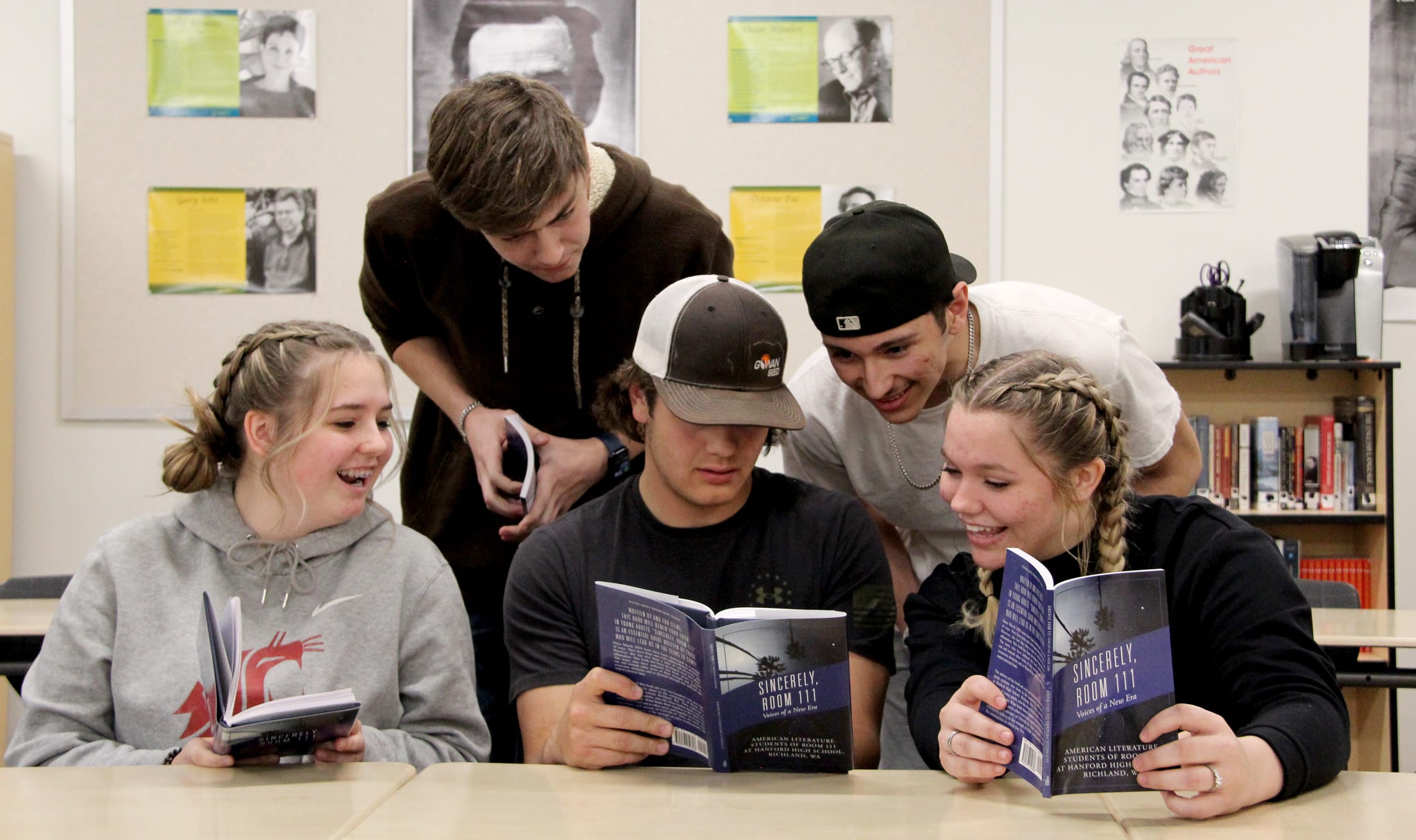 Hanford high students look through copies of "Sincerely, Room 111," their published advice book.