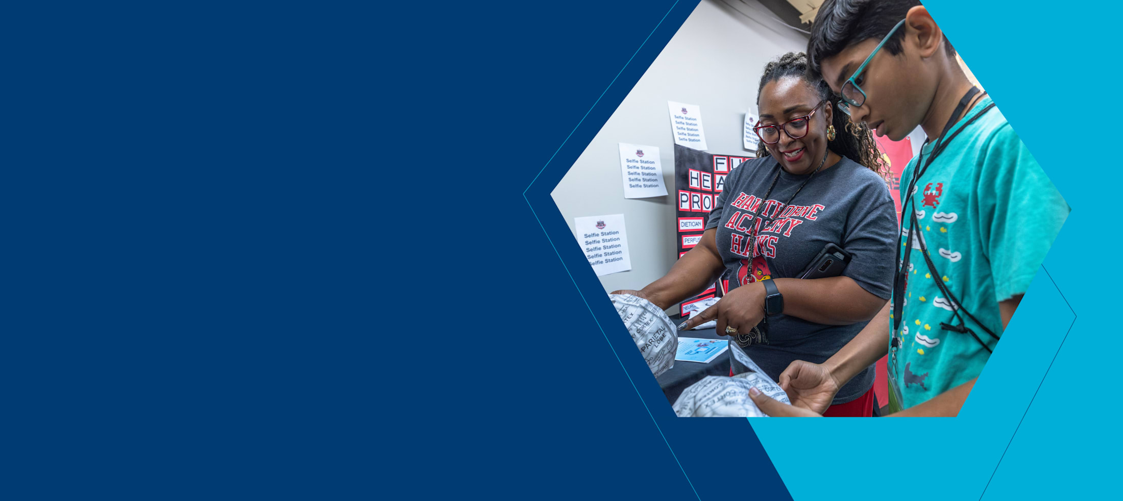 CMS Magnet Fair photo with student and teacher