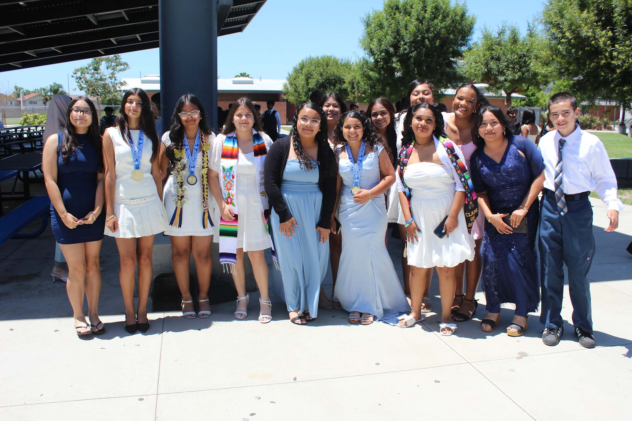 Johnson Middle School students standing together for a photo during graduation.