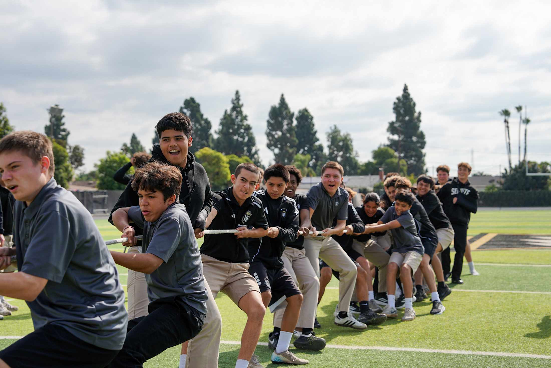 Servite students competing in pool canoe races