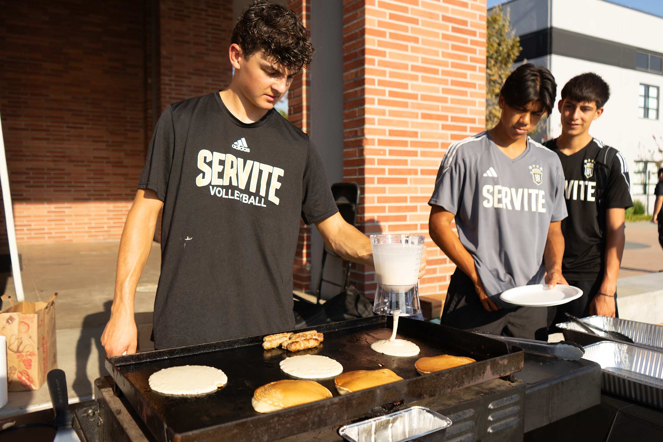 Servite students showing service with humility