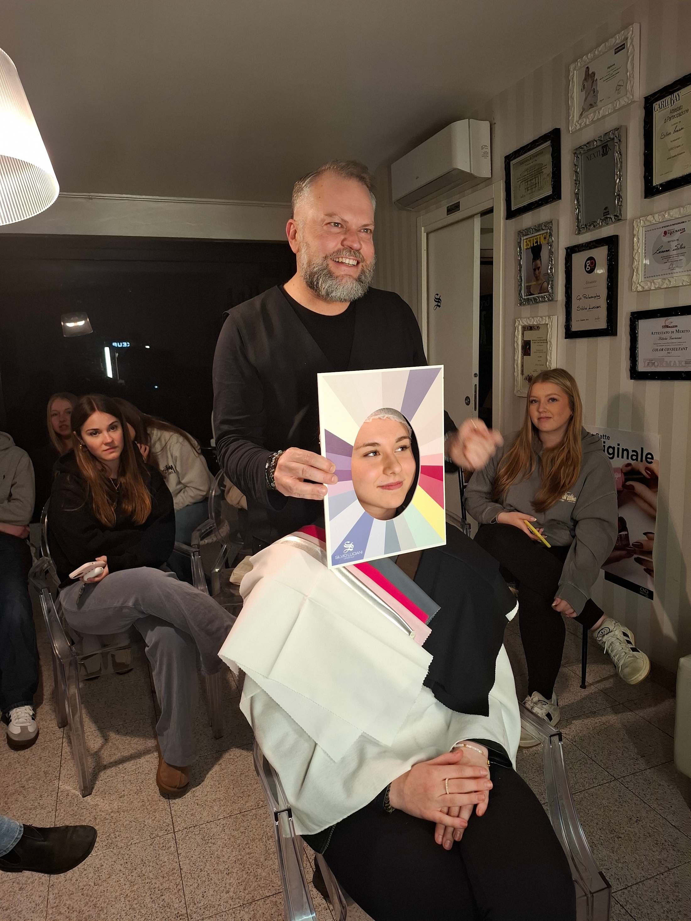 A style consultant leads a colour analysis with a CCI student
