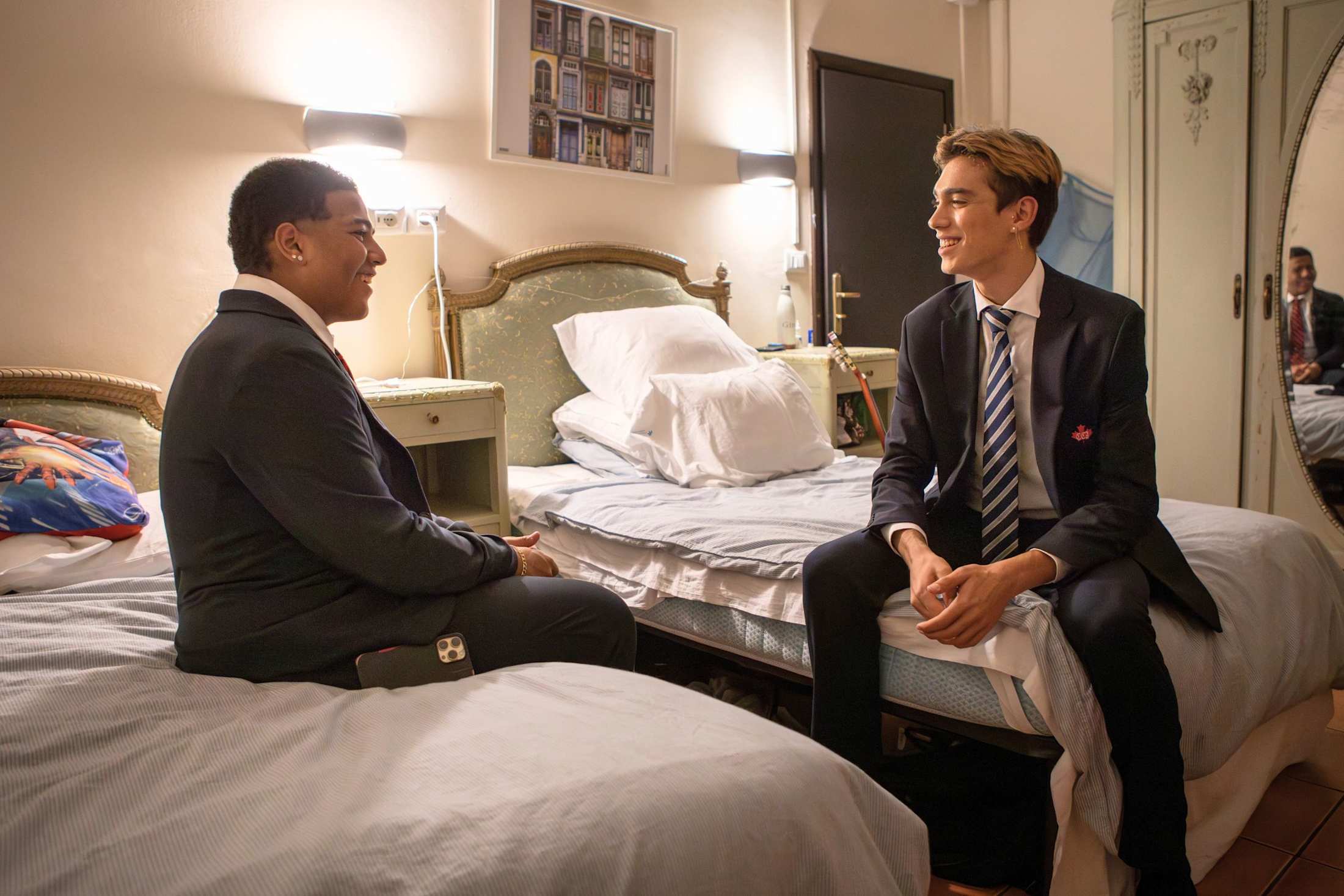 Two Allegria students talking together in their room