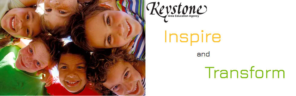 Kids in a circle with the Keystone logo and the words Inspire and transform off to the right of the photo.