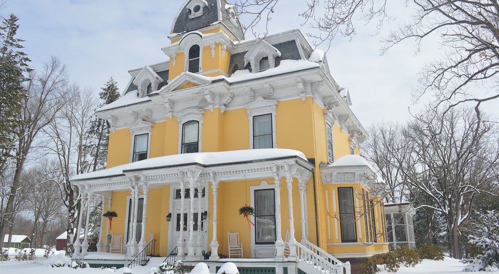 Victorian home on Main Street in winter
