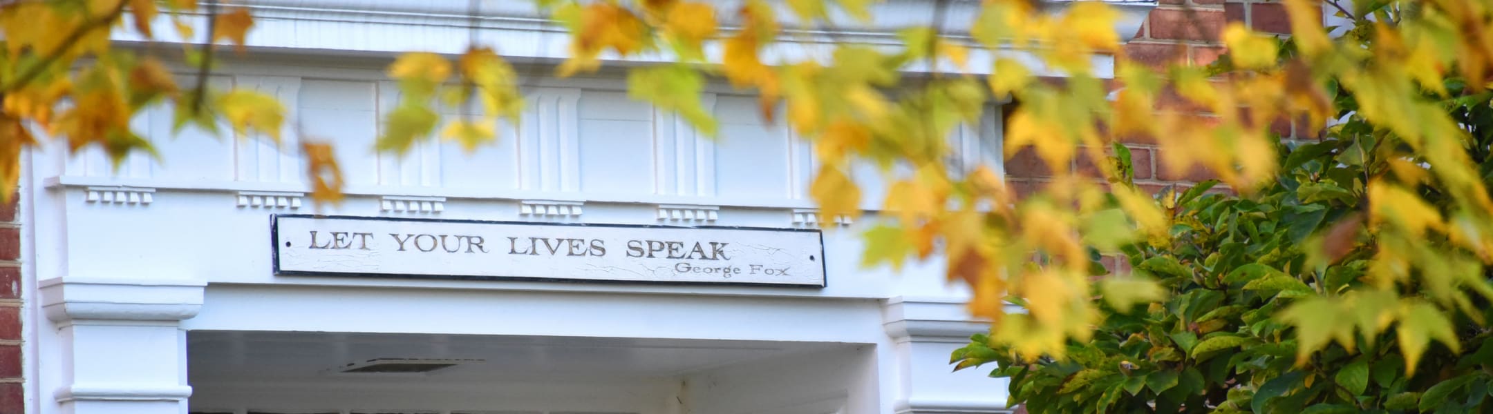 let your lives speak sign over building entrance
