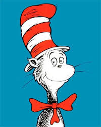 A whimsical cat wearing a tall, red and white striped hat, standing playfully with a mischievous expression.