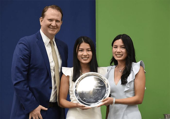 Head of School John Lewis with Valedictorians (Middleton Award) Abbey Miller and Maggie Miller.
