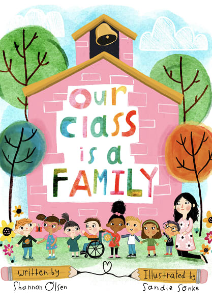 Illustrated children's book cover with "Our Class is a Family" on a pink building. Diverse, happy kids and a teacher stand in front, surrounded by colorful trees.