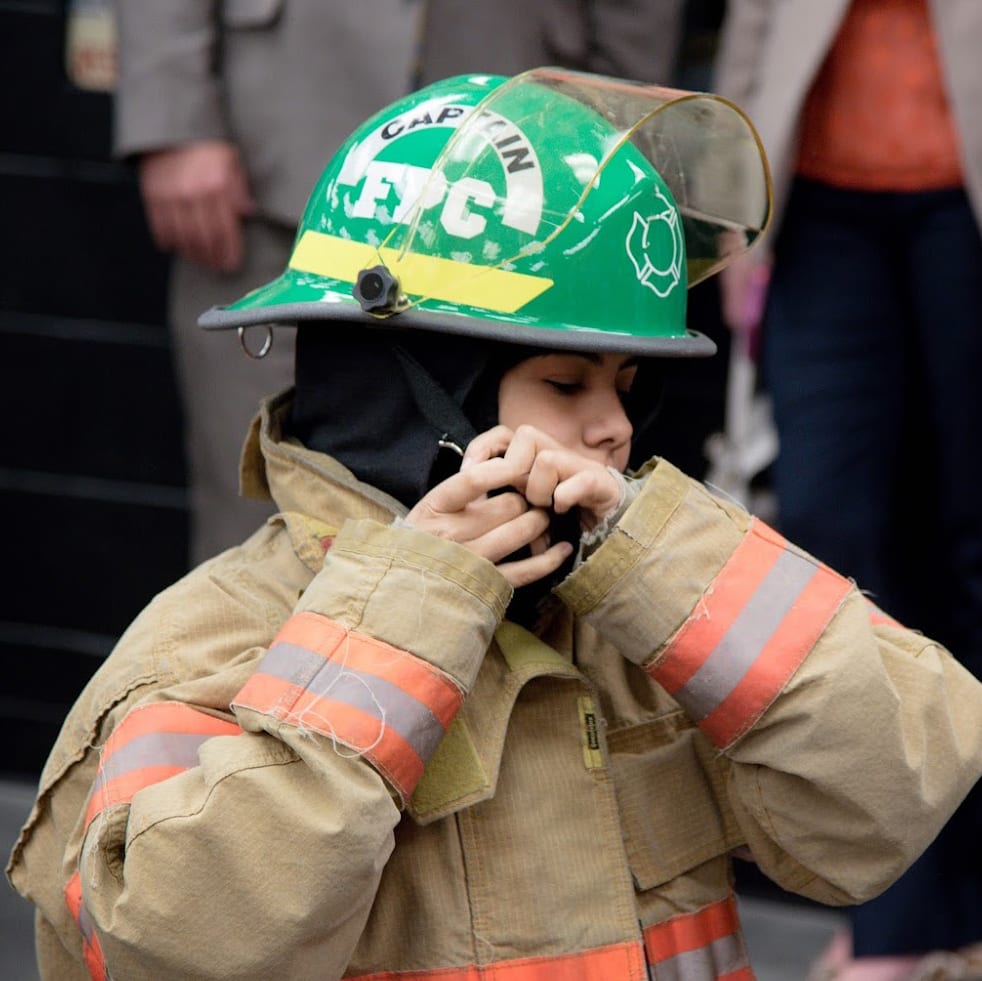 student in firefighter clothing