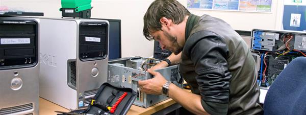 IT tech working on computer hardware