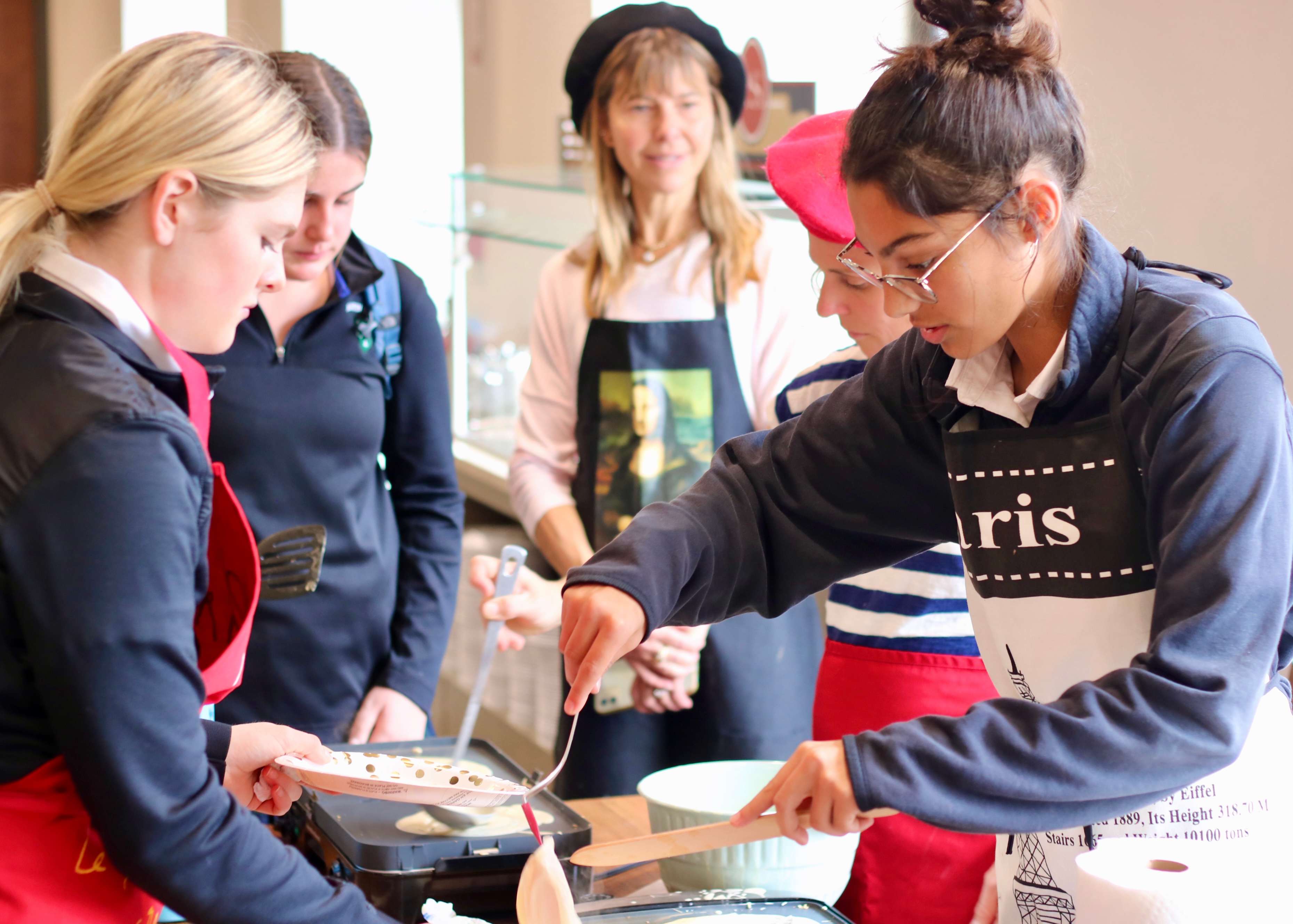 Students made crepes during French Week celebration at Austin Prep.