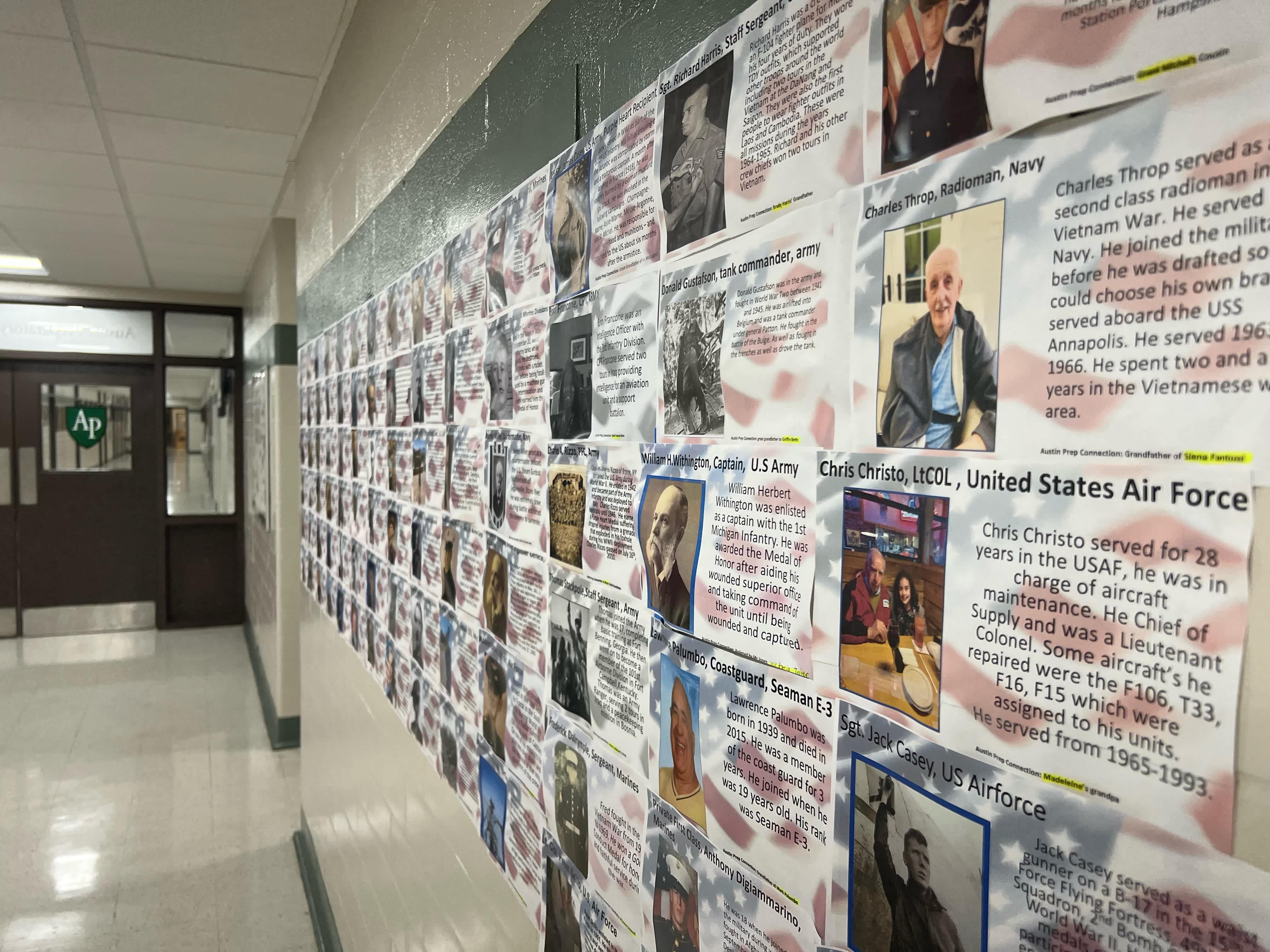 Middle school Hall of Heroes display honoring veterans created by Austin Prep students.