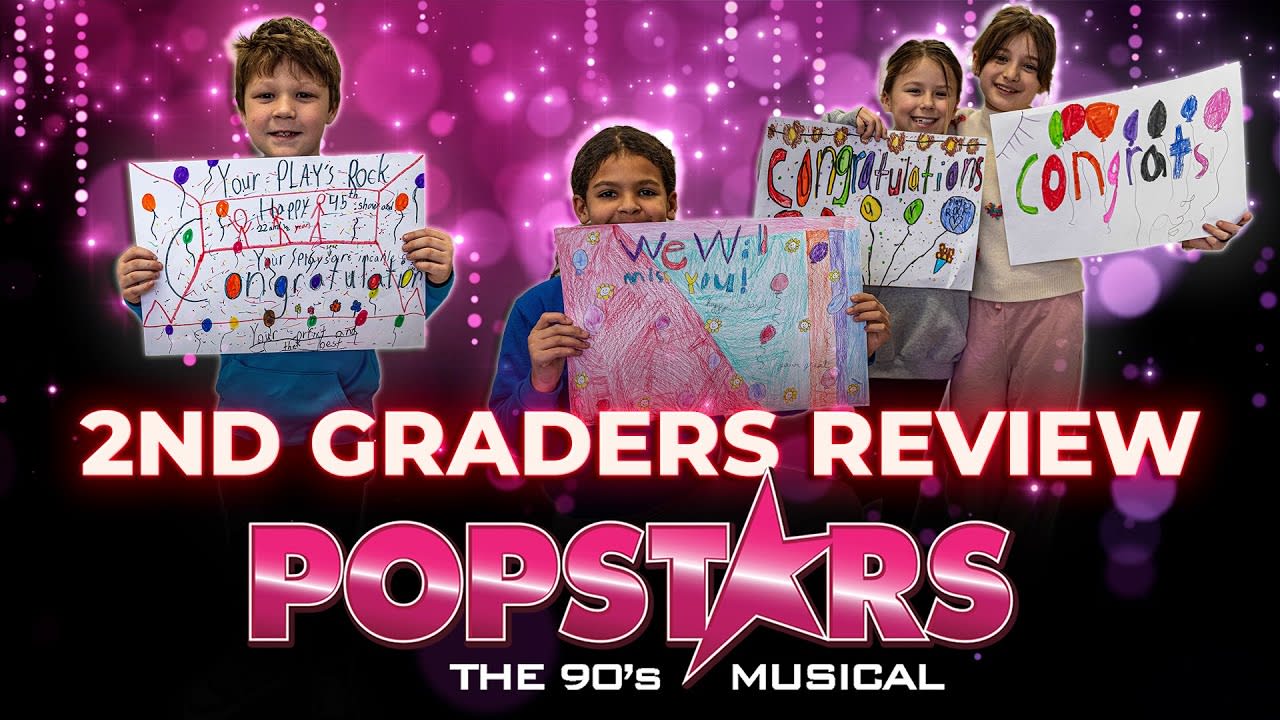 Second Graders Review POPSTARS! Popstars Logo, Students holding poster