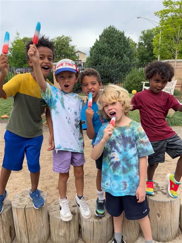 Children enjoying popsicles together during Summer at Stanley