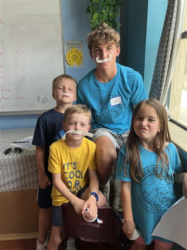 Children enjoying a playful activity together during Summer at Stanley