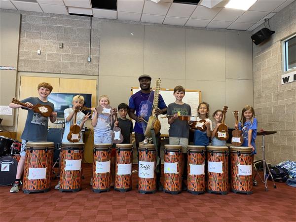 Child drumming during Summer at Stanley
