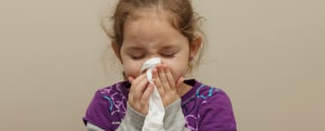 image of little girl sneezing